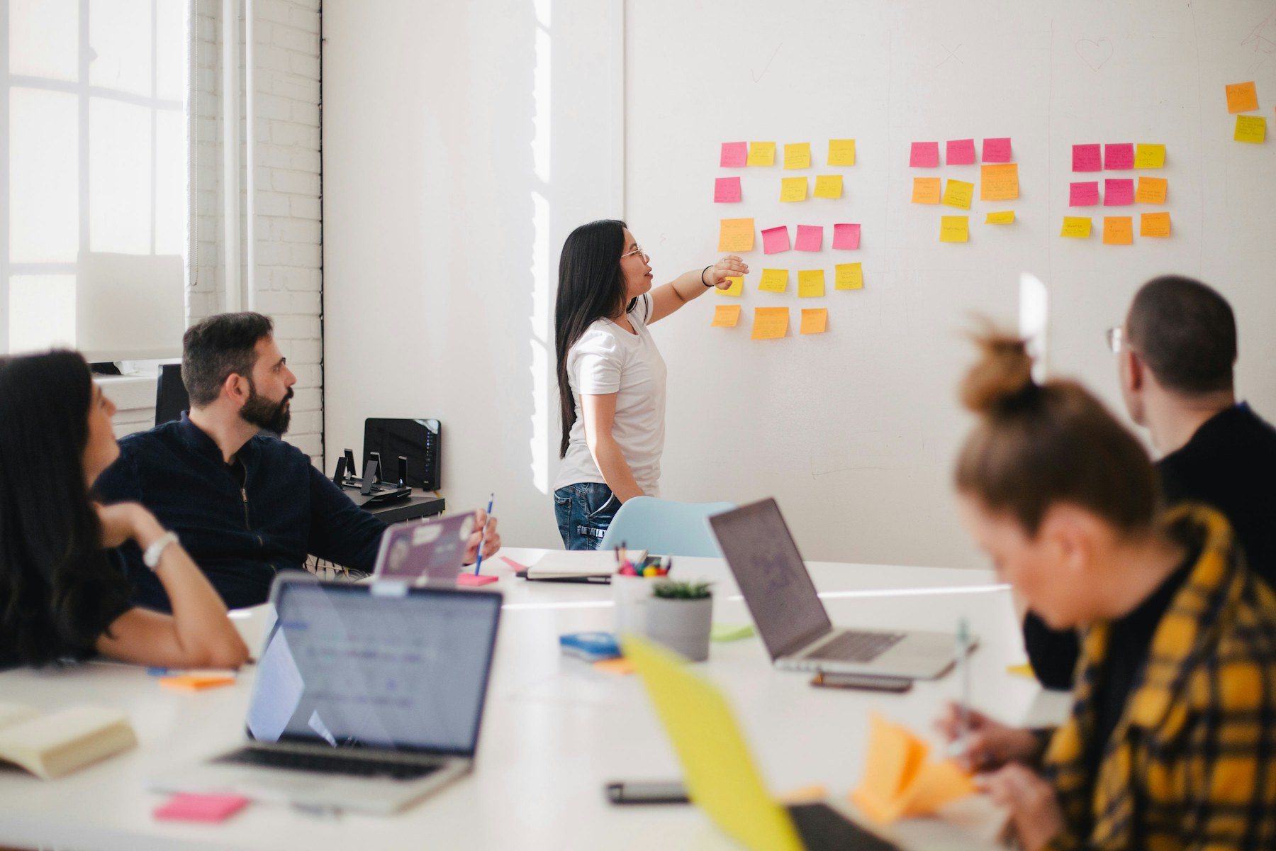 Studio review of creative direction boards around a shared table